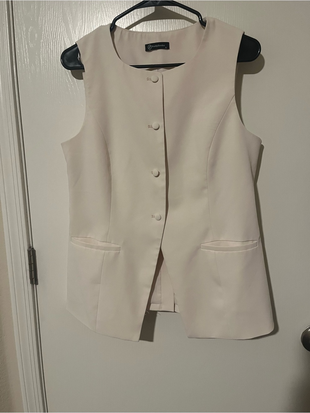 Sleeveless Cream Button-Front Vest by Charming Charlie